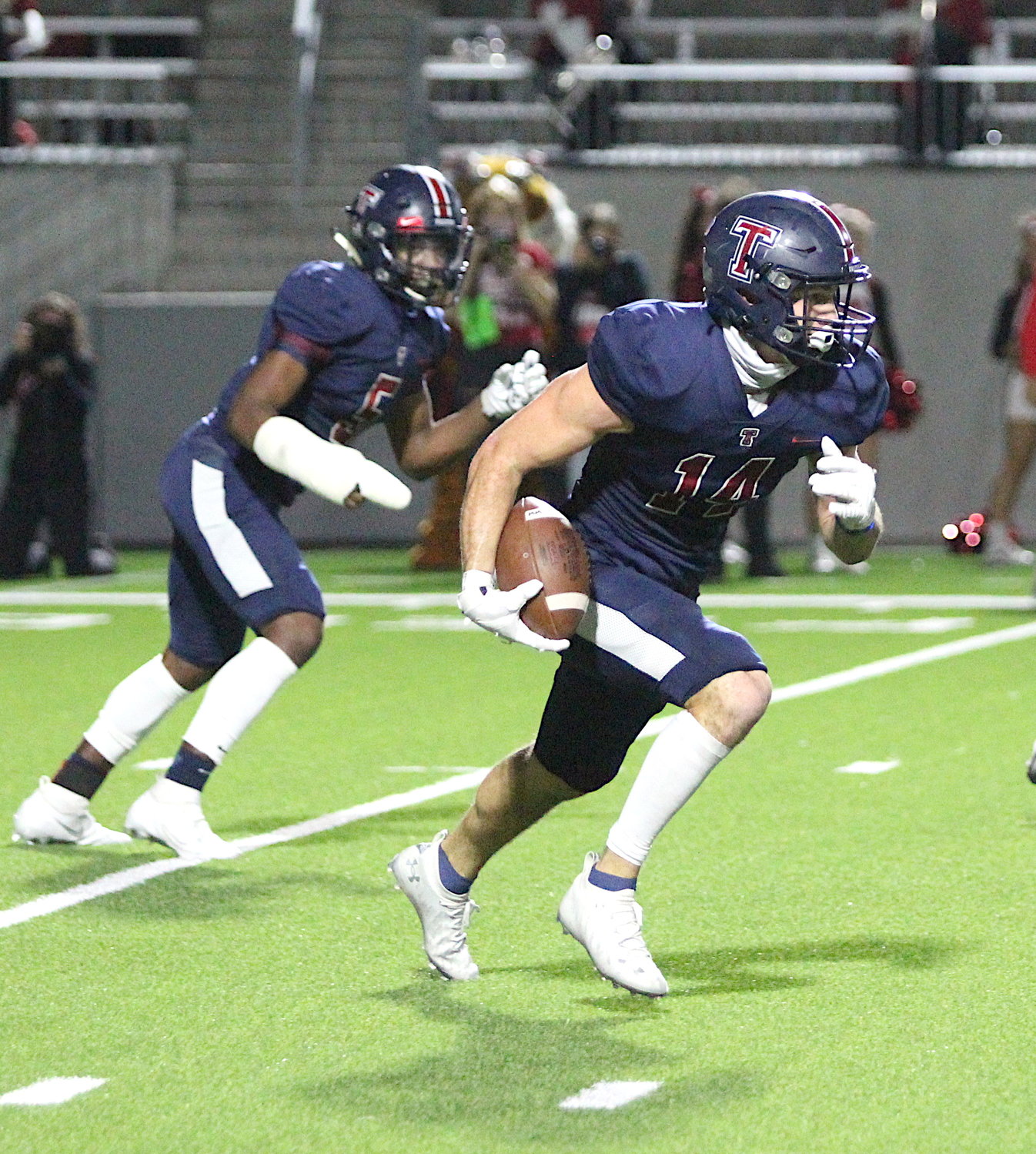 Tompkins senior safety Colby Huerter runs back an interception during a game against Katy earlier this season at Legacy Stadium. Huerter was named District 19-6A’s Defensive Player of the Year.